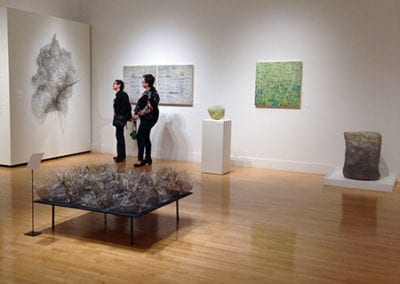 unravel unearth wire sculpture exhibit two people
