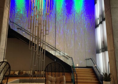Polarnatt stainless steel wire mesh sculpture installation in Nordhaus stairwell blue green lights