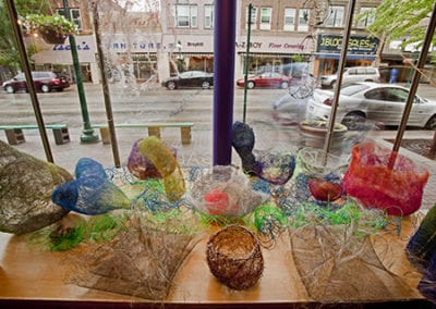 Sweebles in gallery window stainless steel wire mesh sculpture