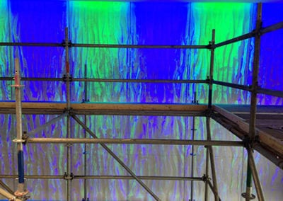 Polarnatt stainless steel wire sculpture installation with blue green lights detail scaffolding during install